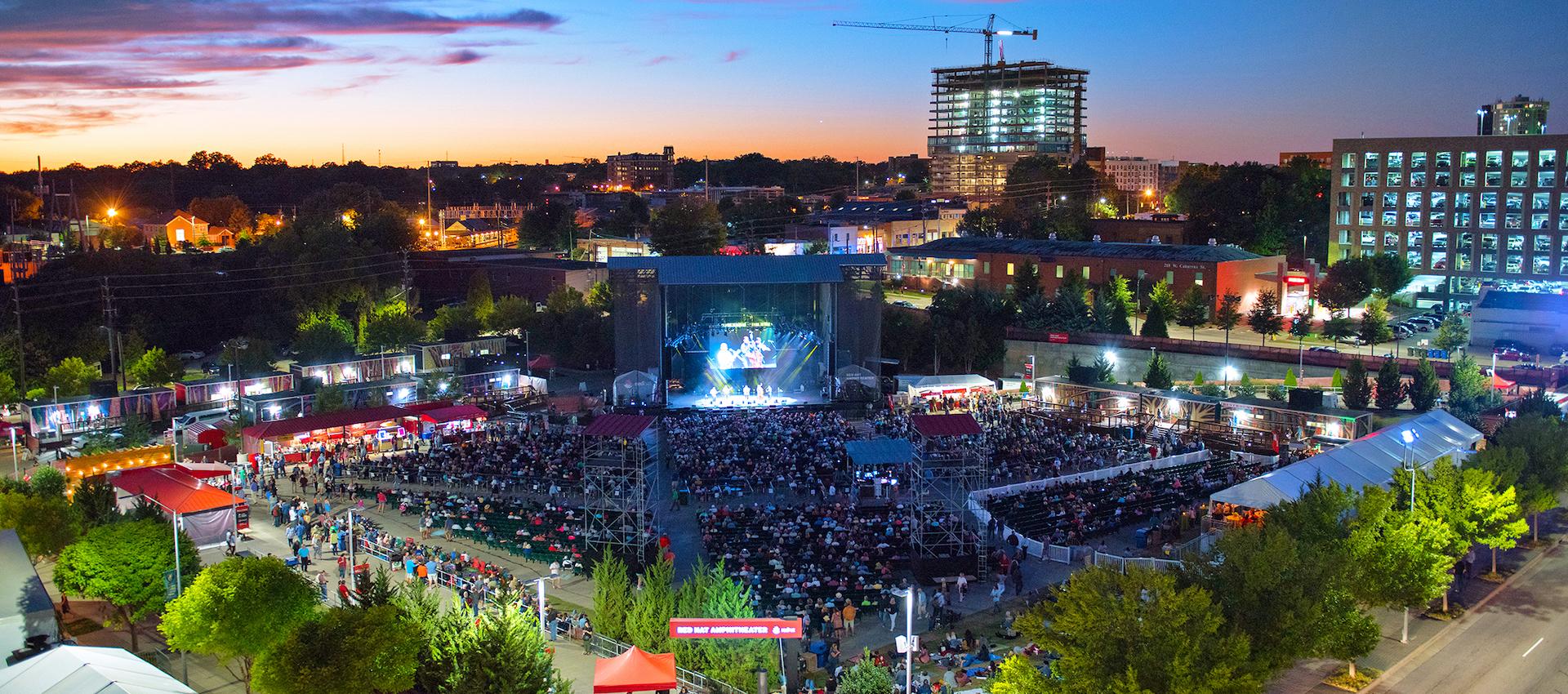 Aerial photo of the Red Hat Amphitheater during a concert showing a large crowd