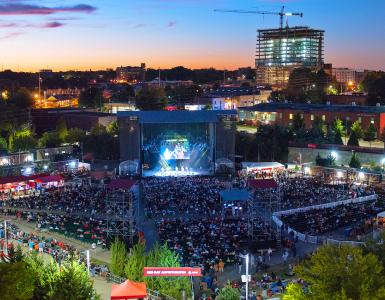 Aerial photo of the Red Hat Amphitheater during a concert showing a large crowd